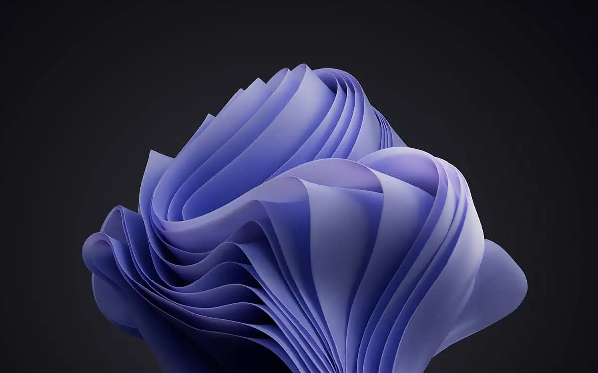 A 3D abstract sculpture composed of layers and folds, resembling flowing fabric. The structure is in soft shades of purple and set against a dark gray background, giving it a smooth and elegant appearance.