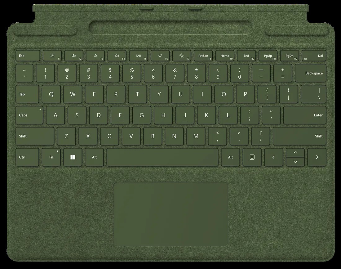 A green keyboard cover featuring a full QWERTY layout with function keys and a touchpad at the bottom. The keys include a mix of letters, numbers, and symbols, along with control keys such as shift, caps lock, tab, and function keys labeled from F1 to F12.