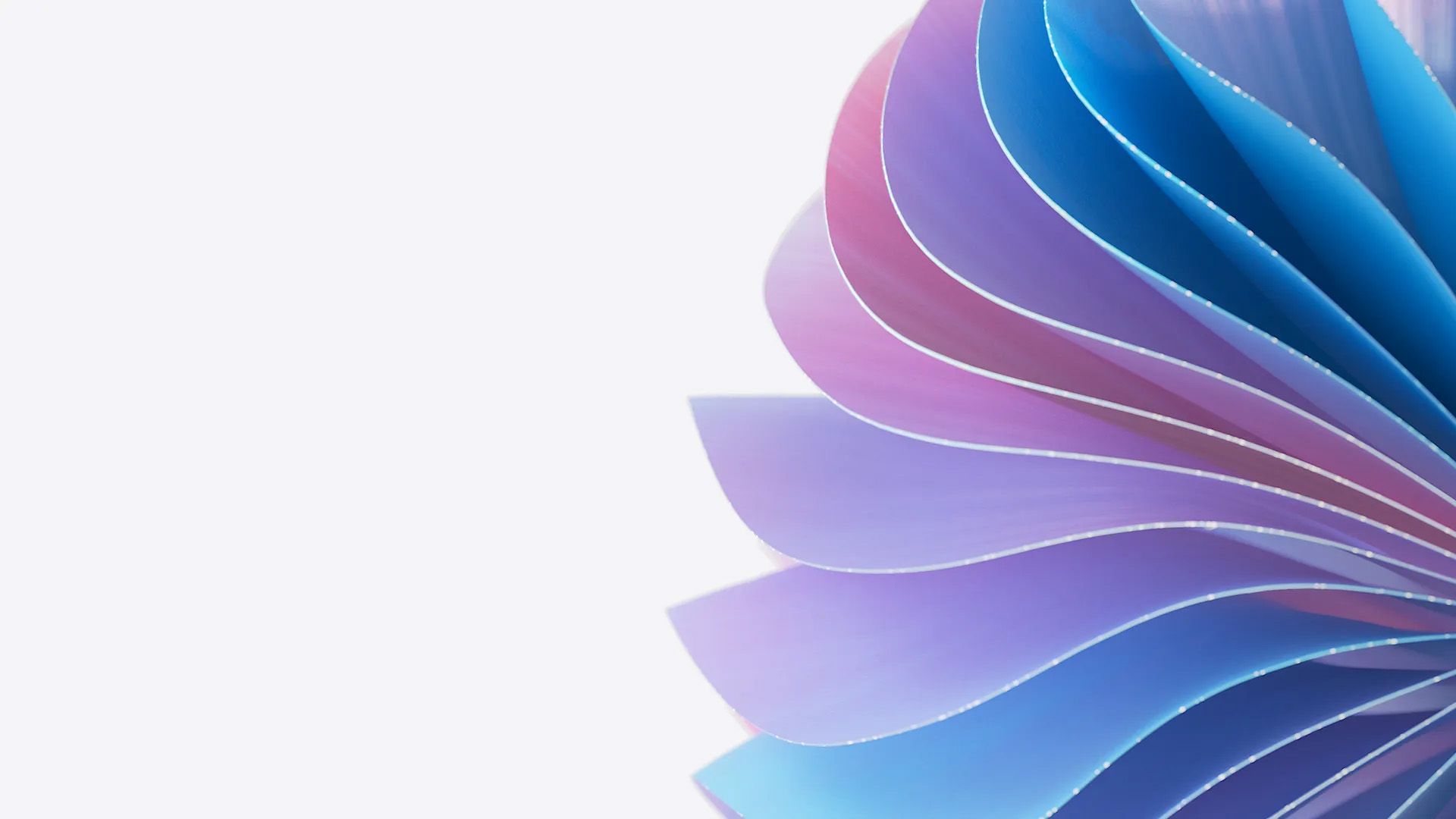 A close-up view of a fanned-out stack of paper sheets in gradient colors of blue, purple, and pink. The sheets are slightly curled, creating an appealing, layered, and abstract visual effect against a white background.