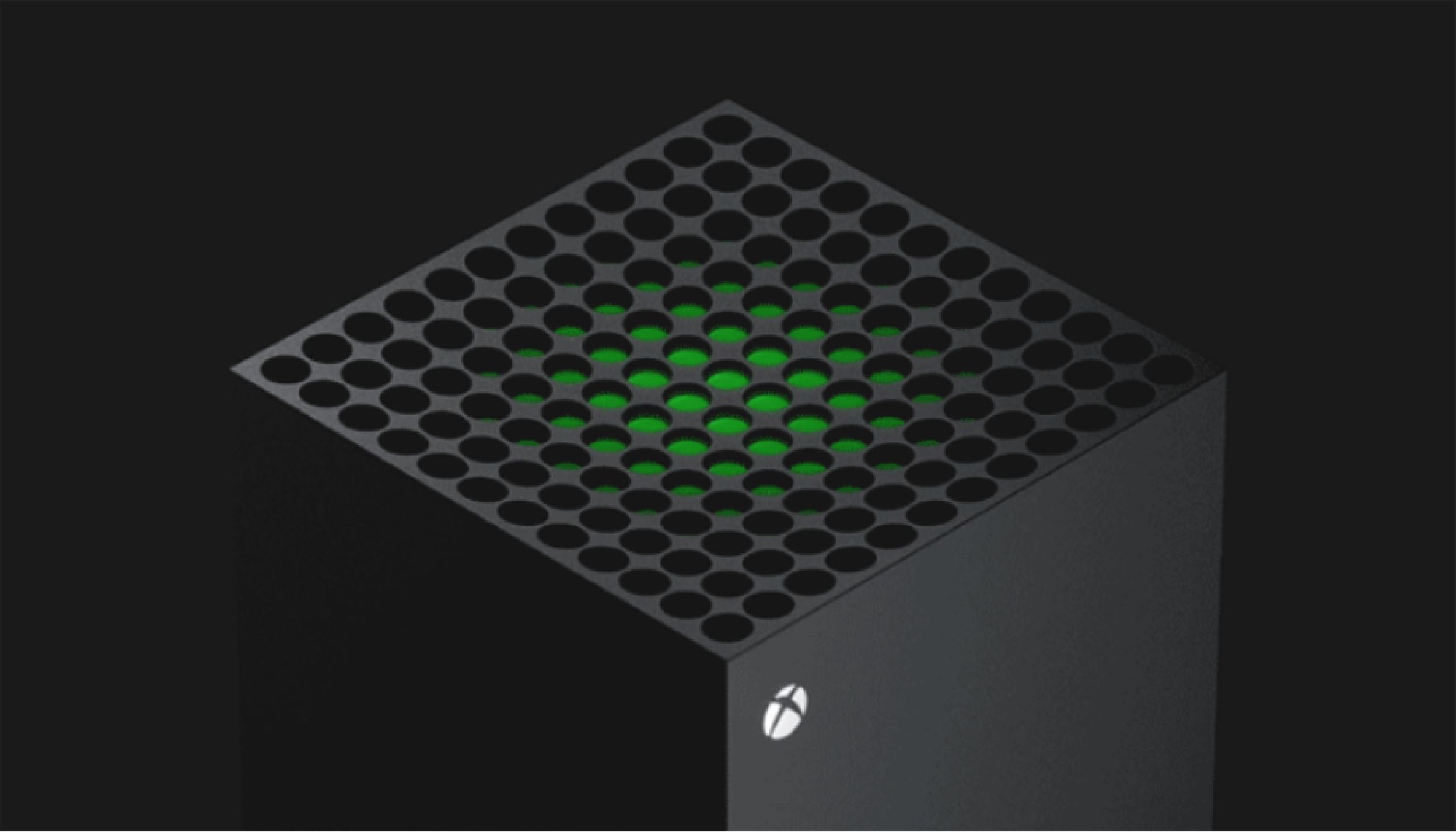 A close-up view of the top of an Xbox Series X console against a dark background. The top surface features a grid of circular holes with a green accent visible through them. The Xbox logo is seen on the front corner of the console.