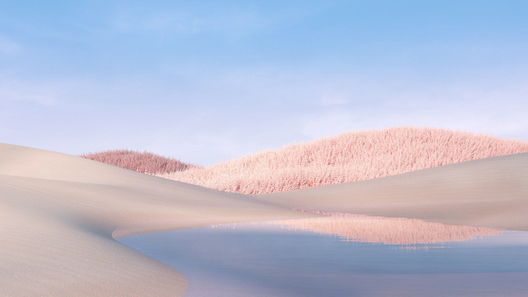 A serene landscape featuring a small, calm lake surrounded by sand dunes and pink-hued trees under a clear blue sky. The water reflects the pastel colors beautifully, creating a peaceful and dreamy atmosphere.