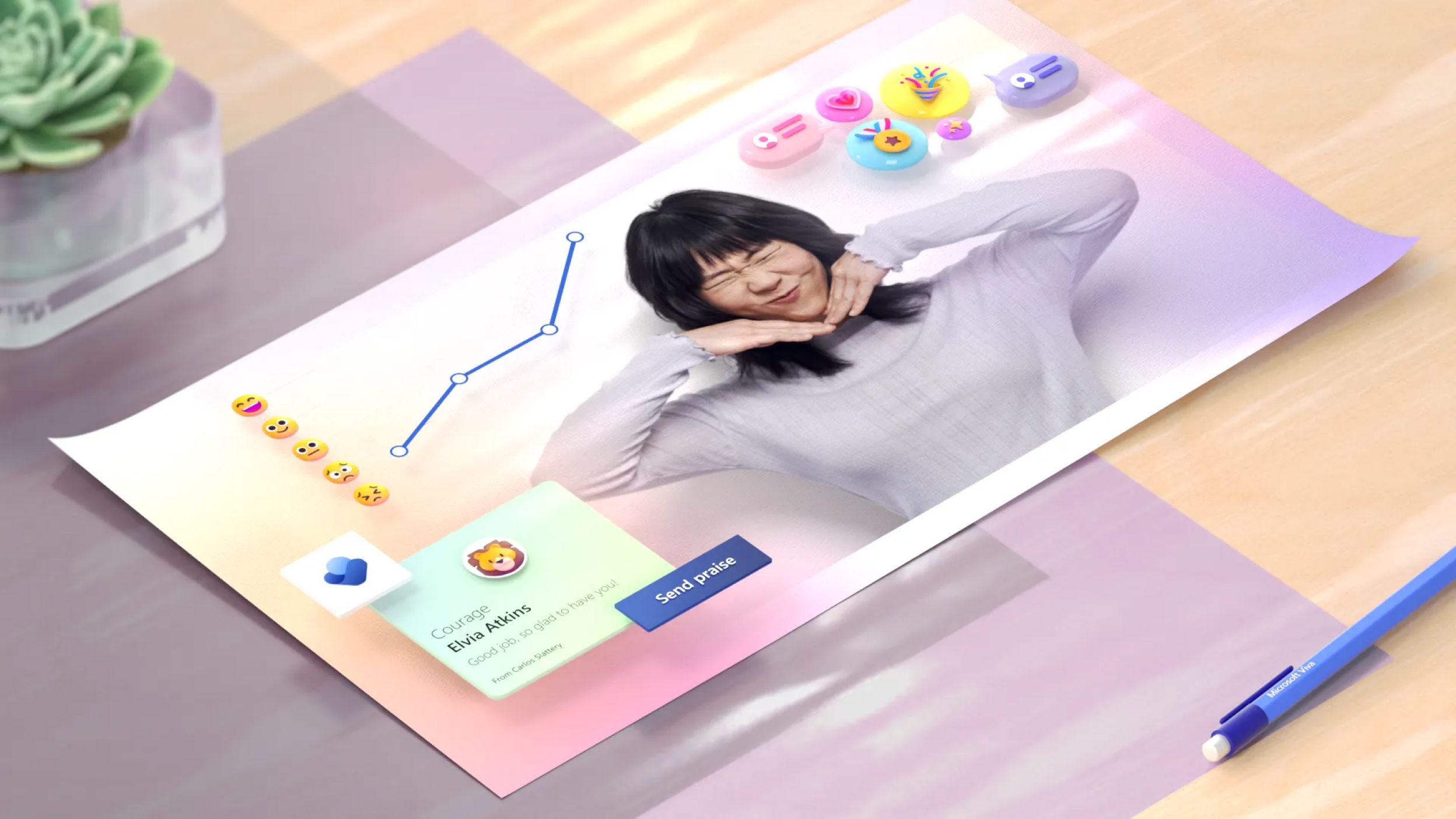 A person holding their hands to their cheeks, smiling, on a digitally manipulated page with various colorful 3D emoji icons and graphs. A nearby flashy message reads "Create Bliss". A blue pen and a succulent plant are visible in the background.