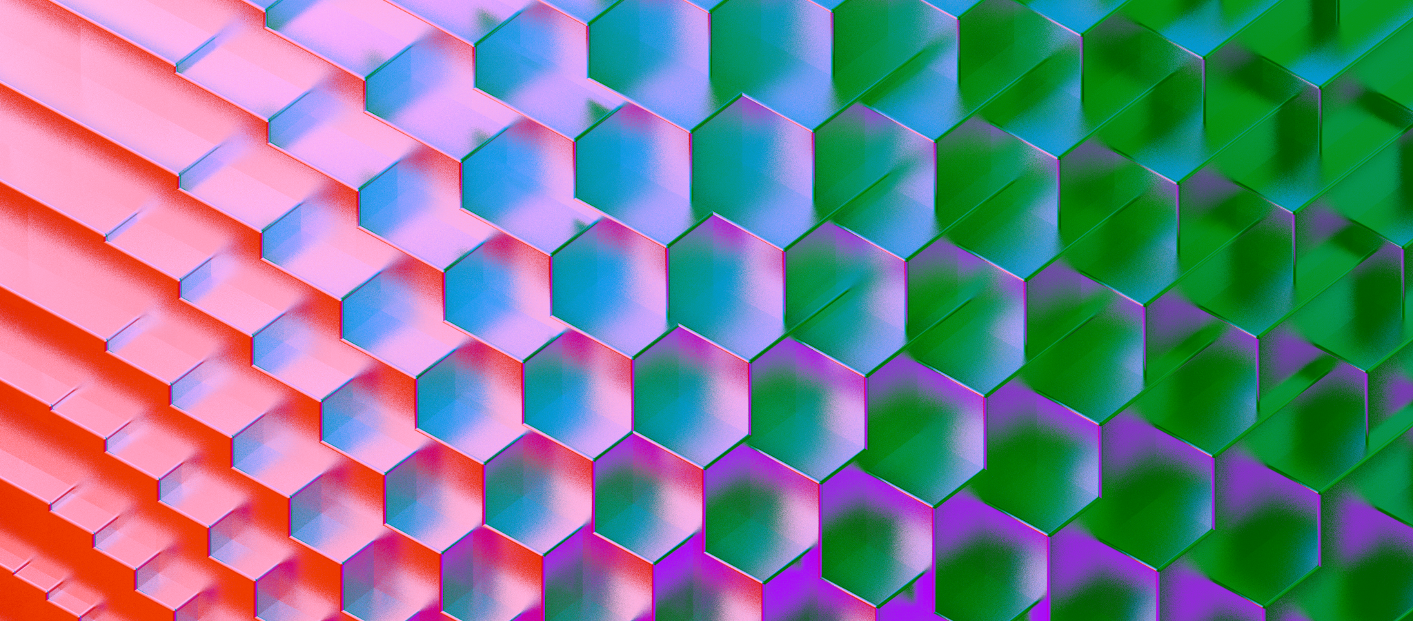 A vibrant pattern of hexagonal tiles in a gradient of red, pink, blue, and green hues, creating an abstract and dynamic visual effect.