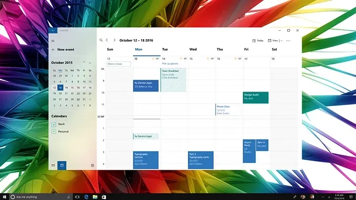 A computer screen displaying a digital calendar for the week of October 12-18, 2015. Various appointments and events are listed in blue and green boxes. The background features a colorful, abstract design with a Windows interface at the bottom.