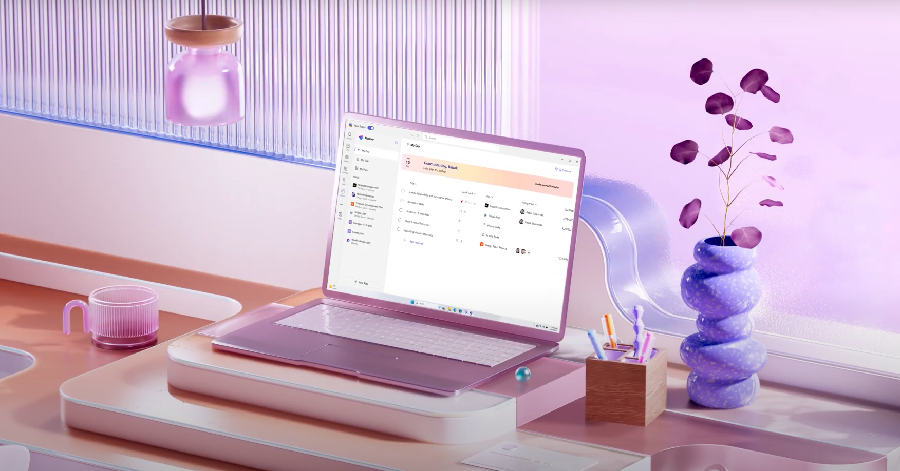 A stylish purple-themed workspace highlights a laptop showcasing a Microsoft Design digital planner. The background features a decorative vase with purple leaves and a shelf with a small jar, creating an atmosphere that's both bright and modern.