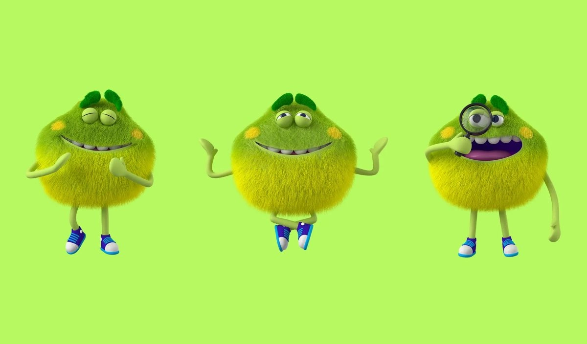 Three fuzzy green and yellow round creatures with blue and white shoes are standing in various poses against a green background. The creatures have big smiles, round eyes, and expressive facial features. One holds a magnifying glass.