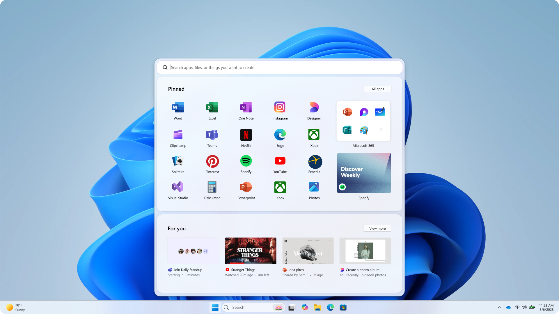 A Windows 11 computer screen showing the Start menu with pinned apps like Edge, Word, Excel, and Spotify, along with a search bar at the top and recommended files and apps below.