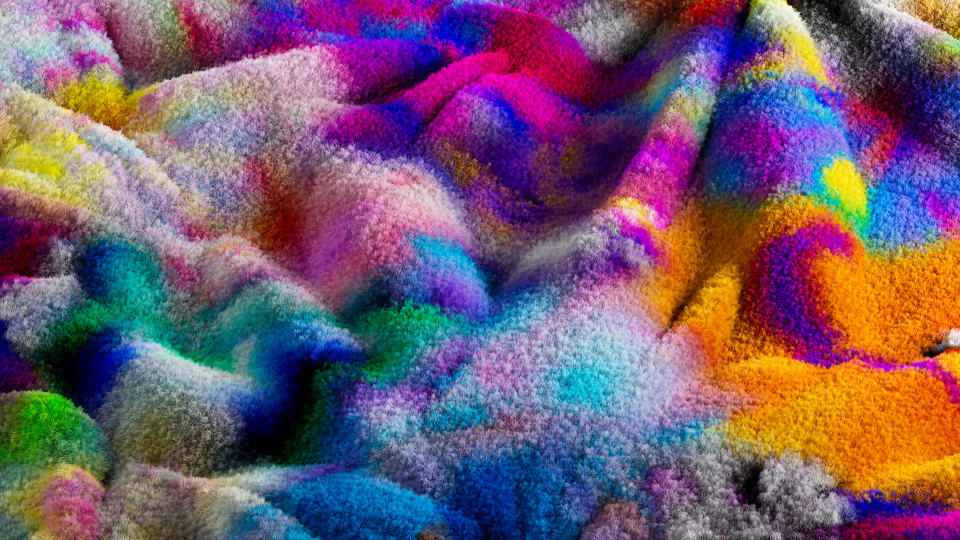 A vibrant, textured surface covered in multicolored, cloud-like patches of pink, purple, blue, green, yellow, and orange creates an abstract, soft, and fluffy appearance—perfect for dreamy wallpapers.