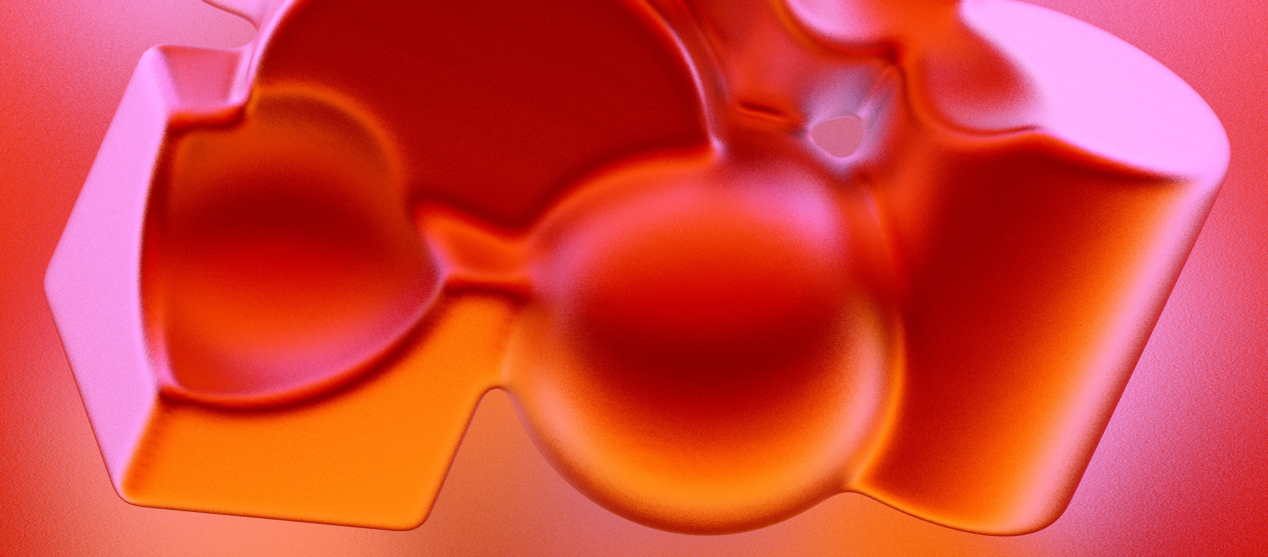 Abstract image featuring smooth, rounded shapes in shades of red, pink, and orange with a glossy, almost glasslike appearance against a gradient background. The forms blend and overlap, creating a soft, fluid composition.
