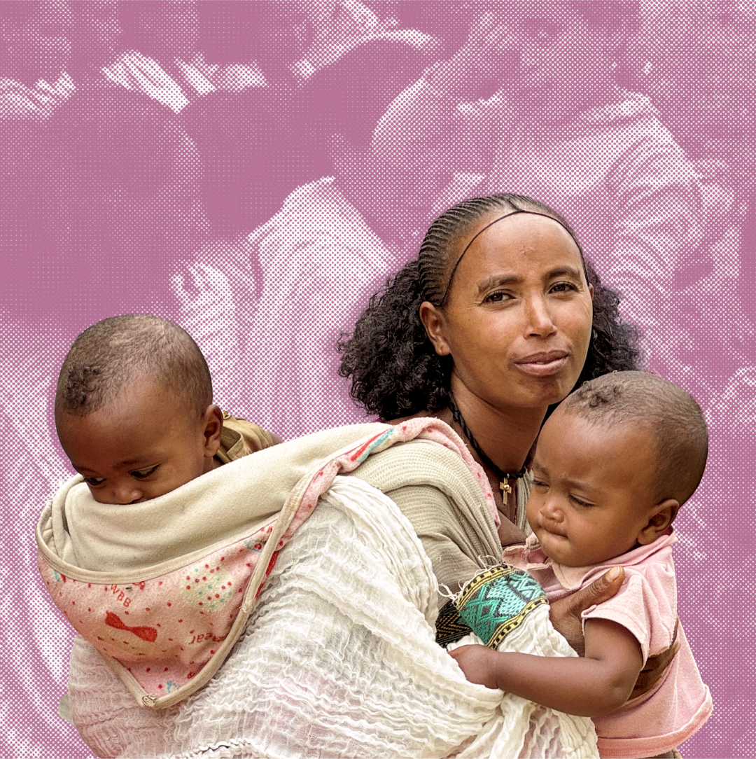 A woman with curly hair holds two young children wrapped in blankets, with a muted pink background showing faint images of other people.
