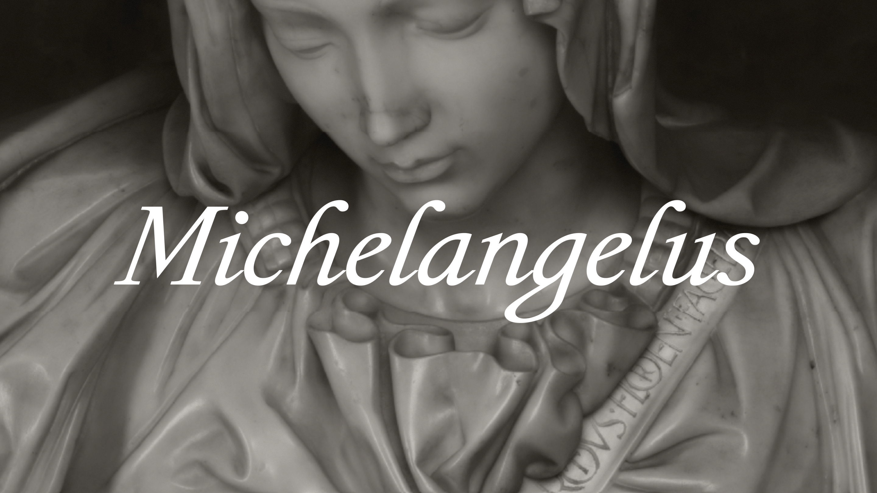 Close-up of a marble statue of a woman with the text “Michelangelus” overlaid in white.